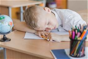 Kid sleeping at desk